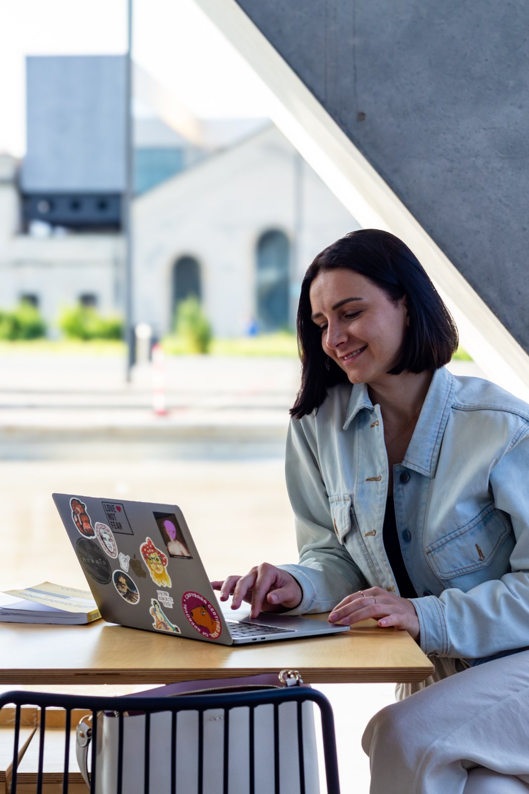 Portrait at a laptop in café light